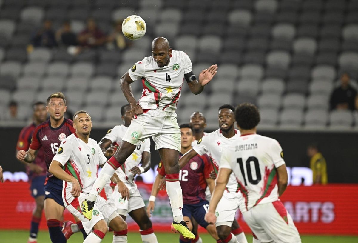 Jun 15, 2025; San Diego, California, USA; Suriname midfielder Dion Malone (4) heads the ball during the first half against Costa Rica in a group stage match of the 2025 Gold Cup at Snapdragon Stadium. Mandatory Credit: Denis Poroy-Imagn Images