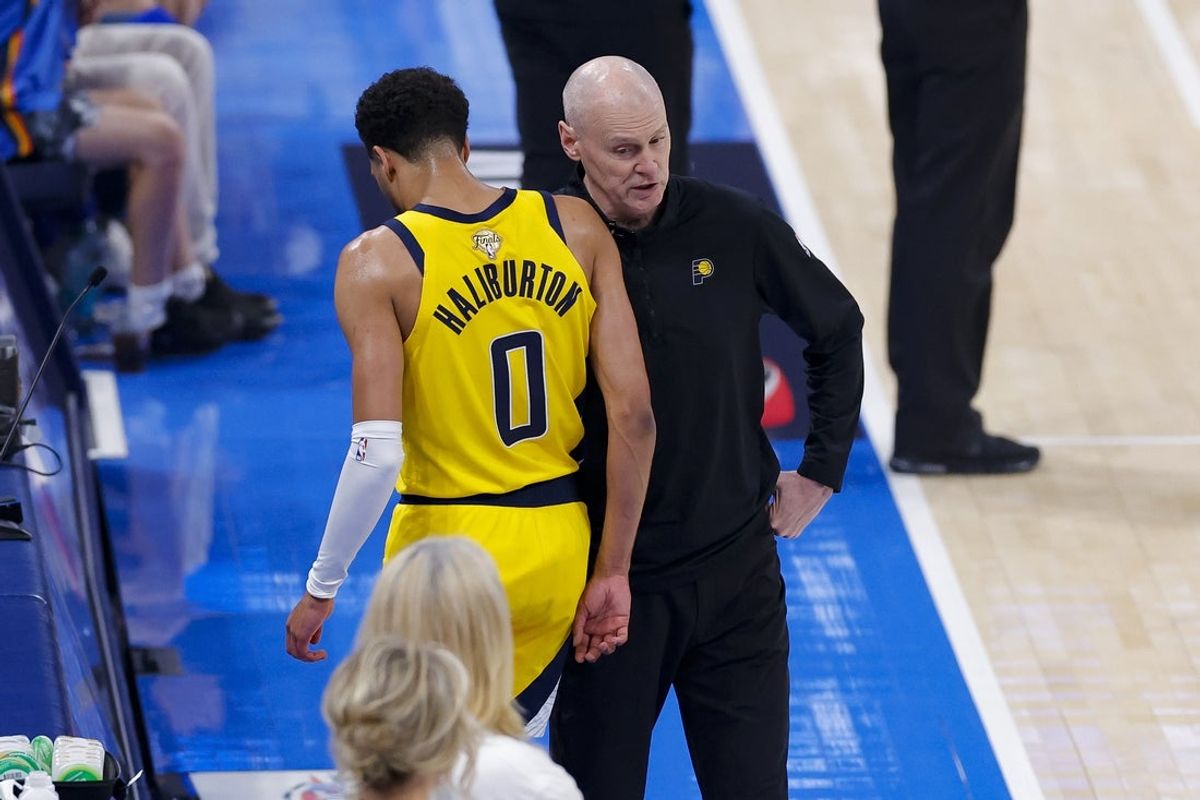 Jun 16, 2025; Oklahoma City, Oklahoma, USA; Indiana Pacers guard Tyrese Haliburton (0) comes off the floor past head coach Rick Carlisle in the first quarter against the Oklahoma City Thunder during game five of the 2025 NBA Finals at Paycom Center. Mandatory Credit: Alonzo Adams-Imagn Images