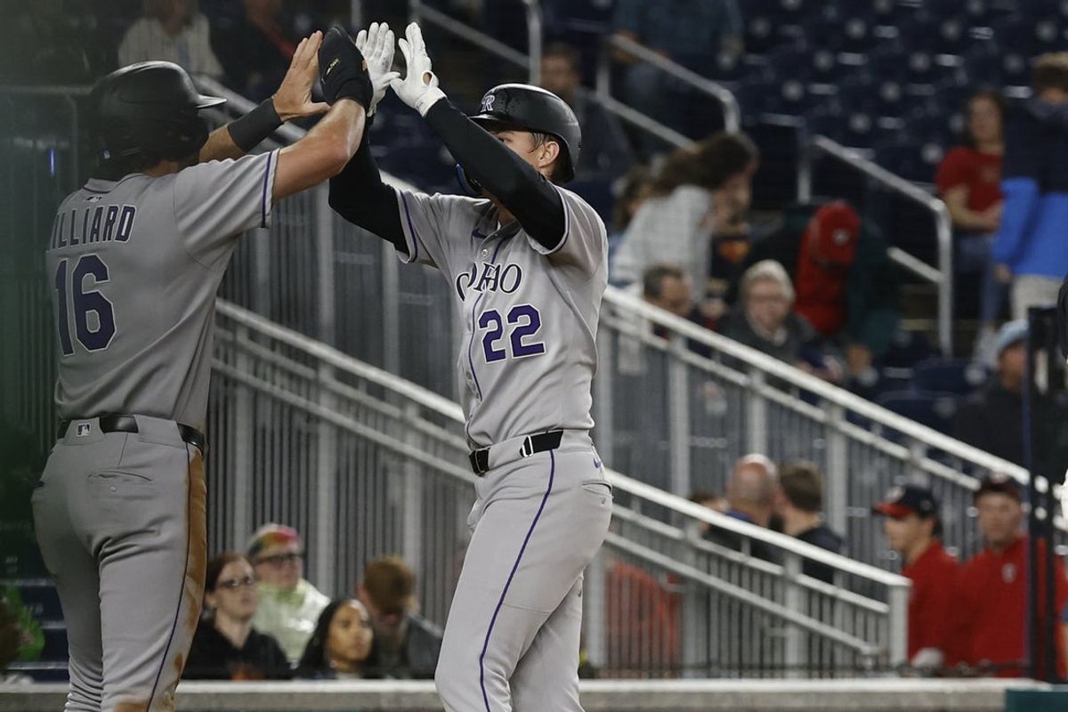 Jun 16, 2025; Washington, District of Columbia, USA; Colorado Rockies outfielder Mickey Moniak (22) celebrates with Rockies outfielder Sam Hilliard (16) after hitting a two run home run against the Washington Nationals during the ninth inning at Nationals Park. Mandatory Credit: Geoff Burke-Imagn Images