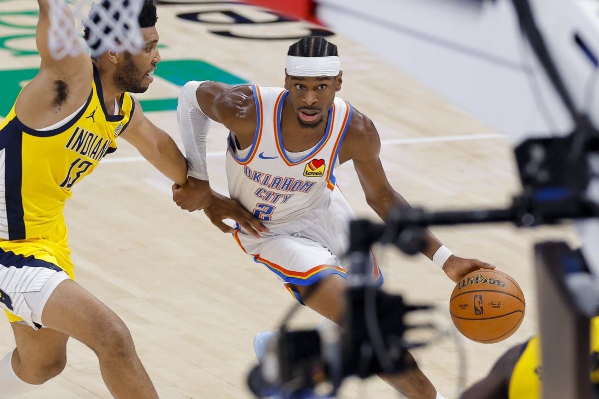 Jun 16, 2025; Oklahoma City, Oklahoma, USA; Oklahoma City Thunder guard Shai Gilgeous-Alexander (2) brings the ball up court past Indiana Pacers center Tony Bradley (13) during the second quarter in game five of the 2025 NBA Finals at Paycom Center. Mandatory Credit: Alonzo Adams-Imagn Images