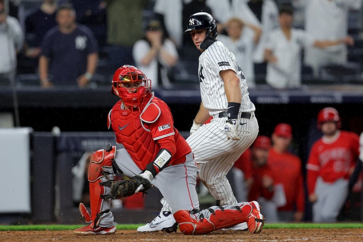 Jun 16, 2025; Bronx, New York, USA; New York Yankees first baseman Paul Goldschmidt (48) reacts after being tagged out at home by Los Angeles Angels catcher Travis d'Arnaud (25) during the eleventh inning at Yankee Stadium. Mandatory Credit: Brad Penner-Imagn Images