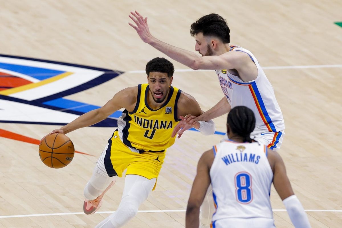 Jun 16, 2025; Oklahoma City, Oklahoma, USA; Indiana Pacers guard Tyrese Haliburton (0) drives to the basket past Oklahoma City Thunder forward Chet Holmgren (7) during the third quarter in game five of the 2025 NBA Finals at Paycom Center. Mandatory Credit: Alonzo Adams-Imagn Images