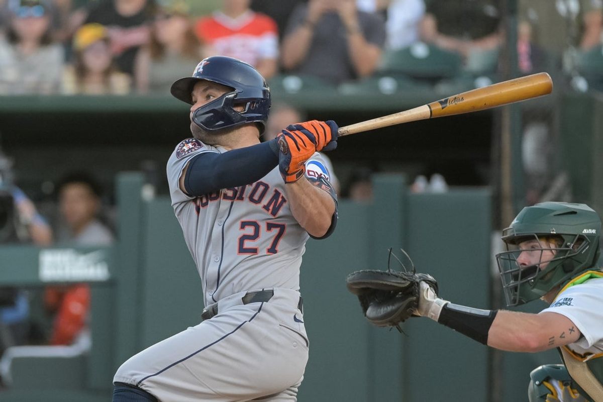 Jun 16, 2025; West Sacramento, California, USA; Houston Astros outfielder Jose Altuve (27) hits a home run against the Athletics during the first inning at Sutter Health Park. Mandatory Credit: Ed Szczepanski-Imagn Images