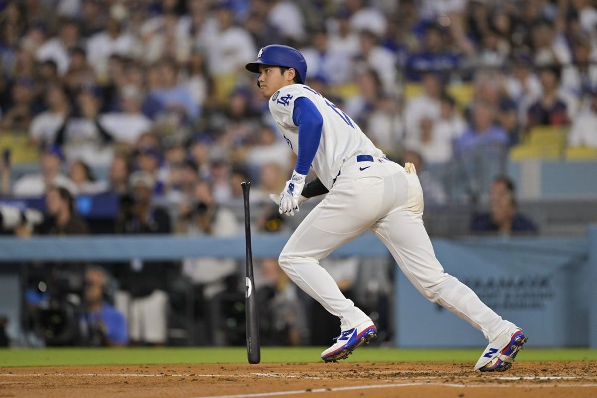 Jun 16, 2025; Los Angeles, California, USA; Los Angeles Dodgers designated hitter Shohei Ohtani (17) hits a single during the fourth inning against the San Diego Padres at Dodger Stadium. Mandatory Credit: Jayne Kamin-Oncea-Imagn Images