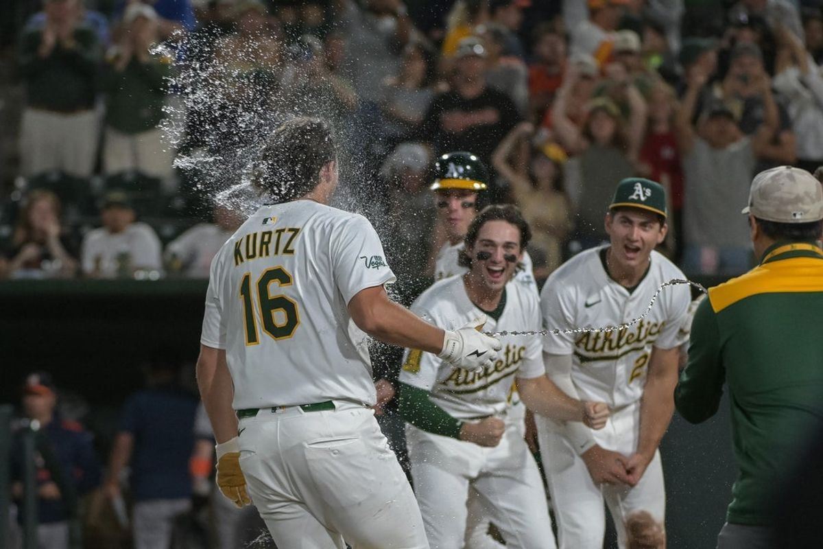 Jun 16, 2025; West Sacramento, California, USA; Athletics first baseman Nick Kurtz (16) celebrates with teammates after hitting a walk off home run against the Houston Astros during the ninth inning at Sutter Health Park. Mandatory Credit: Ed Szczepanski-Imagn Images