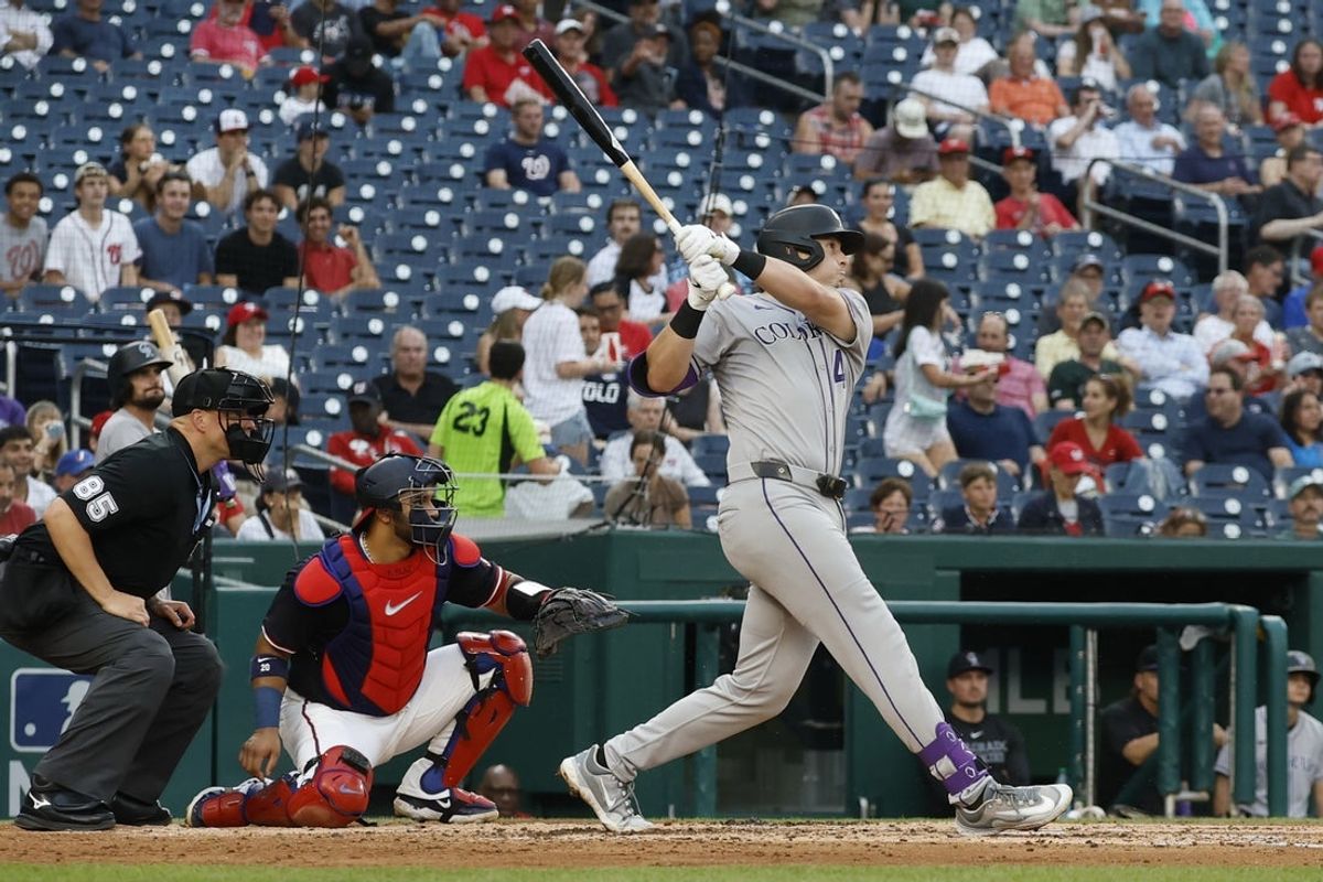 Jun 17, 2025; Washington, District of Columbia, USA; Colorado Rockies first baseman Michael Toglia (4) hits a two run home run against the Washington Nationals during the fourth inning at Nationals Park. Mandatory Credit: Geoff Burke-Imagn Images