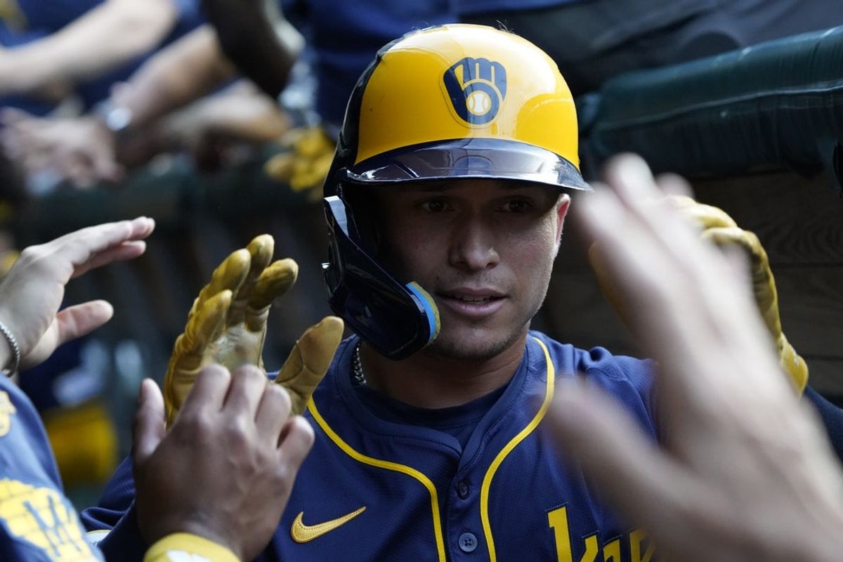 Jun 17, 2025; Chicago, Illinois, USA; Milwaukee Brewers outfielder Isaac Collins (6) is greeted after hitting a two-run home run during the second inning at Wrigley Field. Mandatory Credit: David Banks-Imagn Images