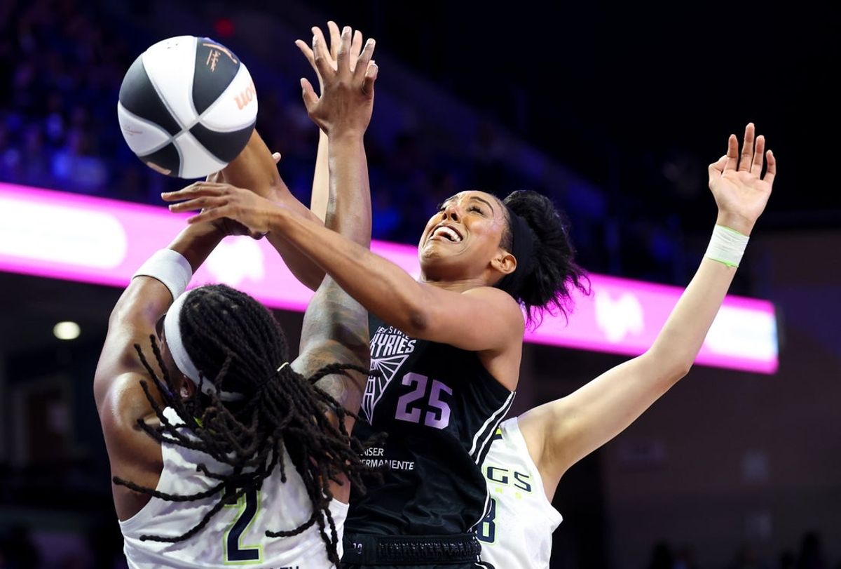 Jun 17, 2025; Arlington, Texas, USA;  Golden State Valkyries forward Monique Billings (25) and Dallas Wings forward Myisha Hines-Allen (2) go for the ball during the first half at College Park Center. Mandatory Credit: Kevin Jairaj-Imagn Images