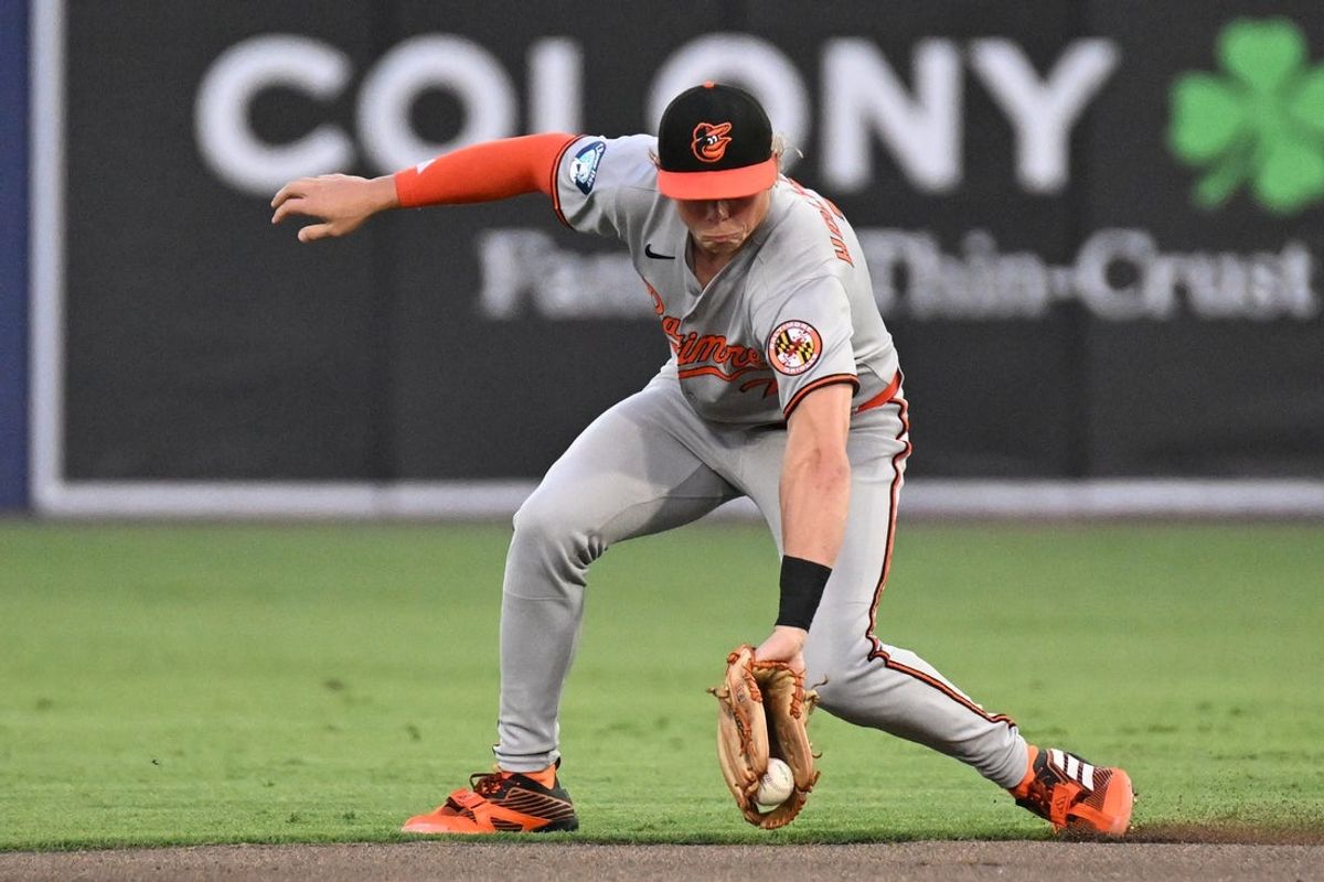 Jun 17, 2025; St. Petersburg, Florida, USA;  Baltimore Orioles second baseman Jackson Holliday (7) fields a ground ball in there second inning against the Tampa Bay Rays  at George M. Steinbrenner Field. Mandatory Credit: Jonathan Dyer-Imagn Images