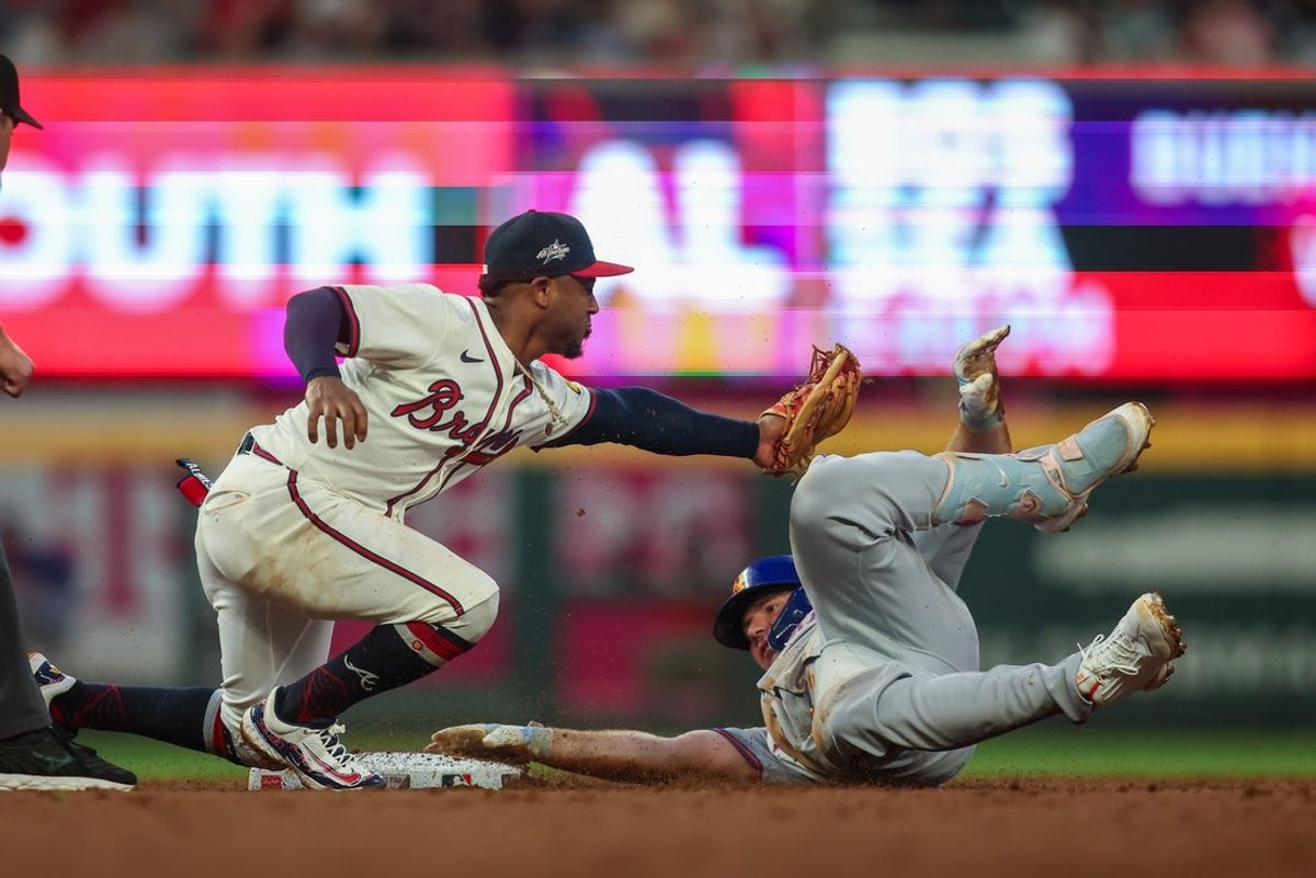 Jun 17, 2025; Atlanta, Georgia, USA; Atlanta Braves second baseman Ozzie Albies (1) tags out New York Mets first baseman Pete Alonso (20) in the third inning at Truist Park. Mandatory Credit: Brett Davis-Imagn Images
