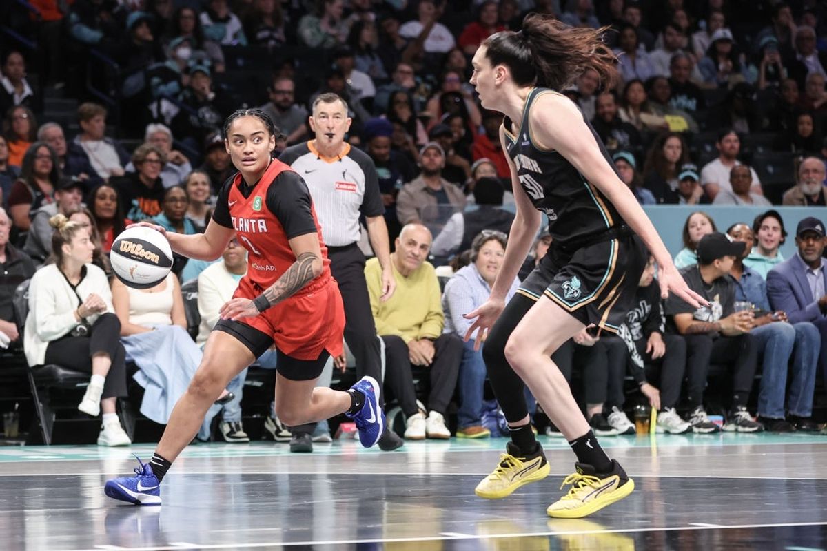 Jun 17, 2025; Brooklyn, New York, USA;  Atlanta Dream guard Te-Hina Paopao (2) looks to drive past New York Liberty forward Breanna Stewart (30) in the first quarter at Barclays Center. Mandatory Credit: Wendell Cruz-Imagn Images