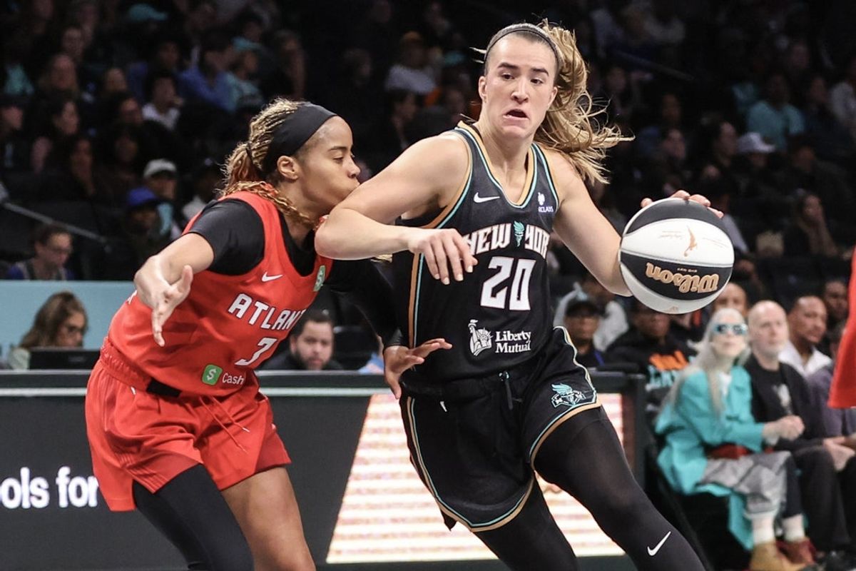 Jun 17, 2025; Brooklyn, New York, USA;  New York Liberty guard Sabrina Ionescu (20) looks to drive past Atlanta Dream guard Jordin Canada (3) in the third quarter at Barclays Center. Mandatory Credit: Wendell Cruz-Imagn Images