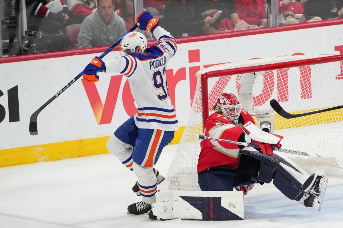 Jun 17, 2025; Sunrise, Florida, USA; Edmonton Oilers right wing Vasily Podkolzin (92) avoids Florida Panthers goaltender Sergei Bobrovsky (72) during the second period in game six of the 2025 Stanley Cup Final at Amerant Bank Arena. Mandatory Credit: Jim Rassol-Imagn Images