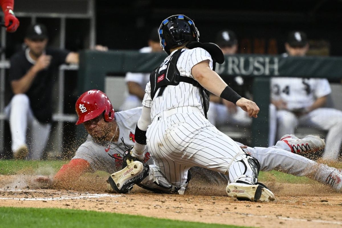 Jun 17, 2025; Chicago, Illinois, USA;  St. Louis Cardinals first baseman Willson Contreras (40) steals home against Chicago White Sox catcher Edgar Quero (7) during the fifth inning at Rate Field. Mandatory Credit: Matt Marton-Imagn Images