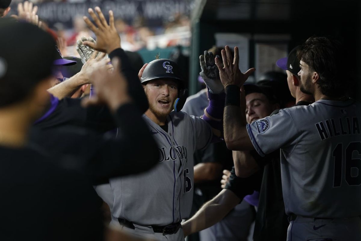 Jun 17, 2025; Washington, District of Columbia, USA; Colorado Rockies catcher Hunter Goodman (15) celebrates with teammates in the dugout after hitting a two run home run against the Washington Nationals during the seventh inning at Nationals Park. Mandatory Credit: Geoff Burke-Imagn Images