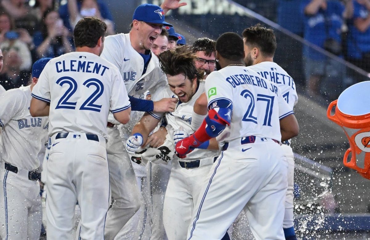 Jun 17, 2025; Toronto, Ontario, CAN;   Toronto Blue Jays right fielder Addison Barger (47, center) celebrates with team mates after hitting a walk off solo home run against the Arizona Diamondbacks in the ninth inning at Rogers Centre. Mandatory Credit: Dan Hamilton-Imagn Images