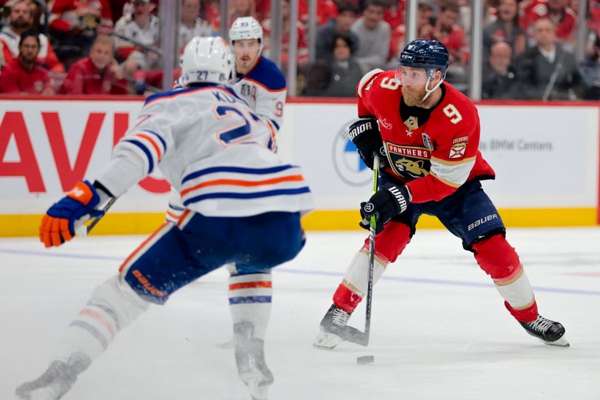 Jun 17, 2025; Sunrise, Florida, USA; Florida Panthers center Sam Bennett (9) controls the puck against the Edmonton Oilers during the second period in game six of the 2025 Stanley Cup Final at Amerant Bank Arena. Mandatory Credit: Sam Navarro-Imagn Images