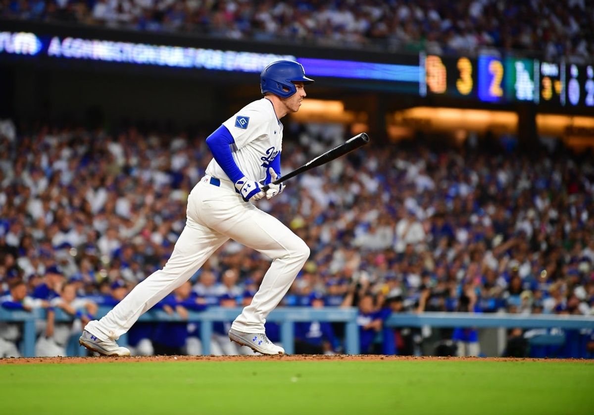Jun 17, 2025; Los Angeles, California, USA;  Los Angeles Dodgers first baseman Freddie Freeman (5) hits a single during the third inning against the San Diego Padres at Dodger Stadium. Mandatory Credit: Gary A. Vasquez-Imagn Images
