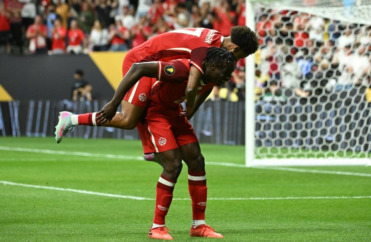 Jun 17, 2025; Vancouver, British Columbia, CAN; Canada forward Promise David (24) celebrates with forward Tajon Buchanan (17) after scoring in the second half during a group stage match of the 2025 Gold Cup against Honduras at BC Place. Mandatory Credit: Simon Fearn-Imagn Images