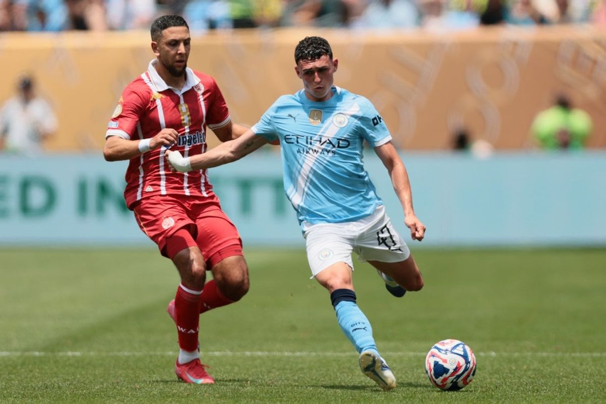 Jun 18, 2025; Philadelphia, Pennsylvania, USA; Manchester City midfielder Phil Foden (47) controls the ball against Wydad AC forward Mohamed Rayhi (8) in the second half during a group stage match of the 2025 FIFA Club World Cup at Lincoln Financial Field. Mandatory Credit: Caean Couto-Imagn Images