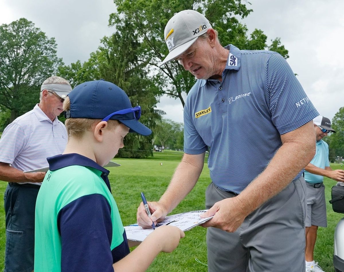 J.J. Granata, 8 of Akron gets an autograph from Ernie Els during the Kaulig Companies Championship: Pro-Am at Firestone Country Club on Wednesday, June 18, 2025 in Akron