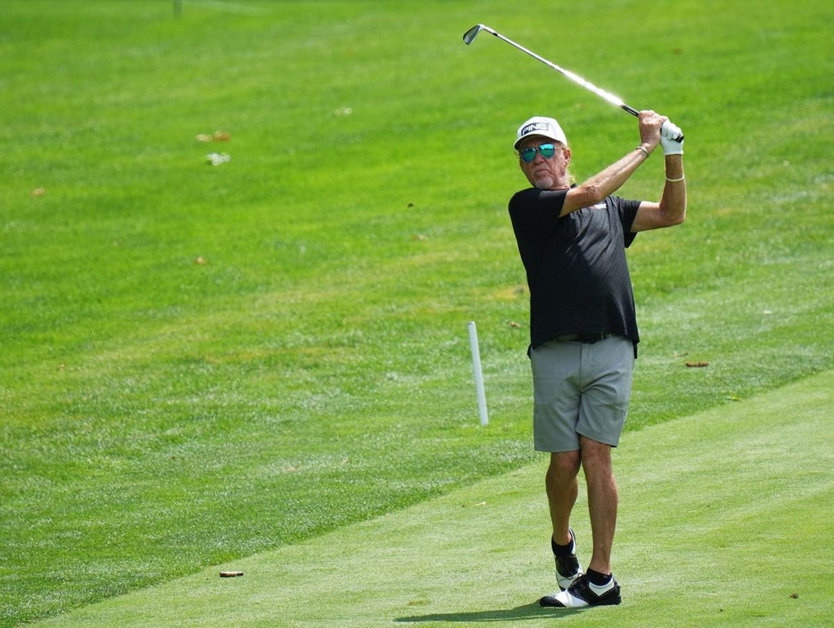 Miguel Angel Jimenez hits his approach shot on the 8th hole during the Kaulig Companies Championship: Pro-Am at Firestone Country Club on Wednesday, June 18, 2025 in Akron