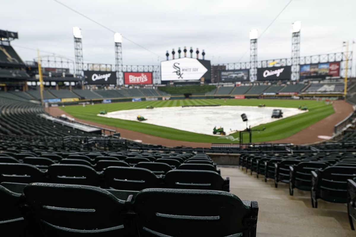 Jun 18, 2025; Chicago, Illinois, USA; Tarp covers the field as tonight's MLB game between the Chicago White Sox and St. Louis Cardinals was postponed at Rate Field due to heavy rains in the Chicagoland area. Mandatory Credit: Kamil Krzaczynski-Imagn Images