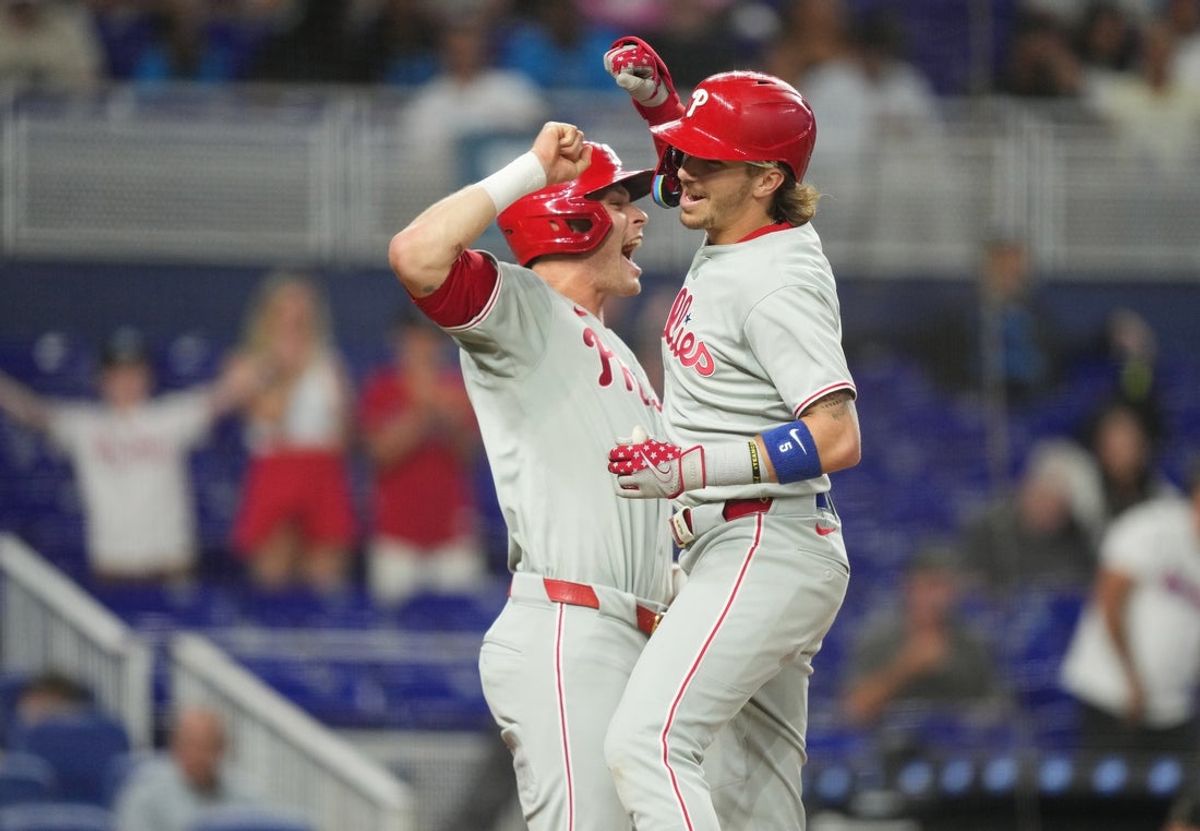 Jun 18, 2025; Miami, Florida, USA;  Philadelphia Phillies second baseman Bryson Stott, right, celebrates his three-run home run against the Miami Marlins with teammate Max Kepler (17) in the fourth inning at loanDepot Park. Mandatory Credit: Jim Rassol-Imagn Images