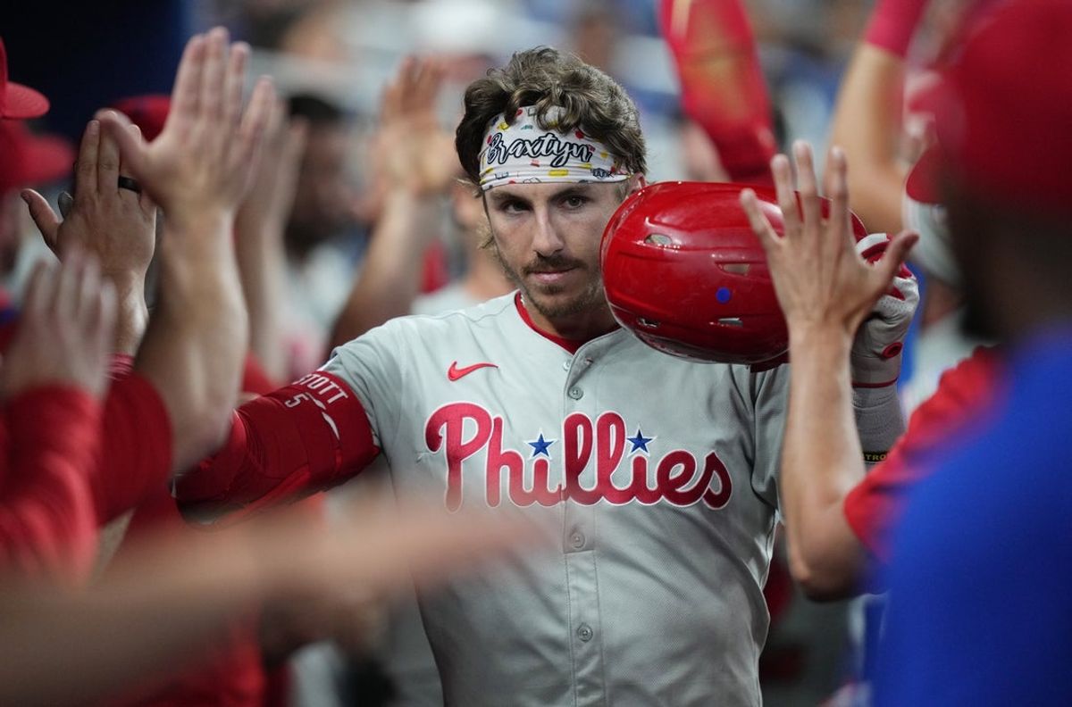Jun 18, 2025; Miami, Florida, USA;  Philadelphia Phillies second baseman Bryson Stott (5) celebrates a three-run home run against the Miami Marlins in the fourth inning at loanDepot Park. Mandatory Credit: Jim Rassol-Imagn Images