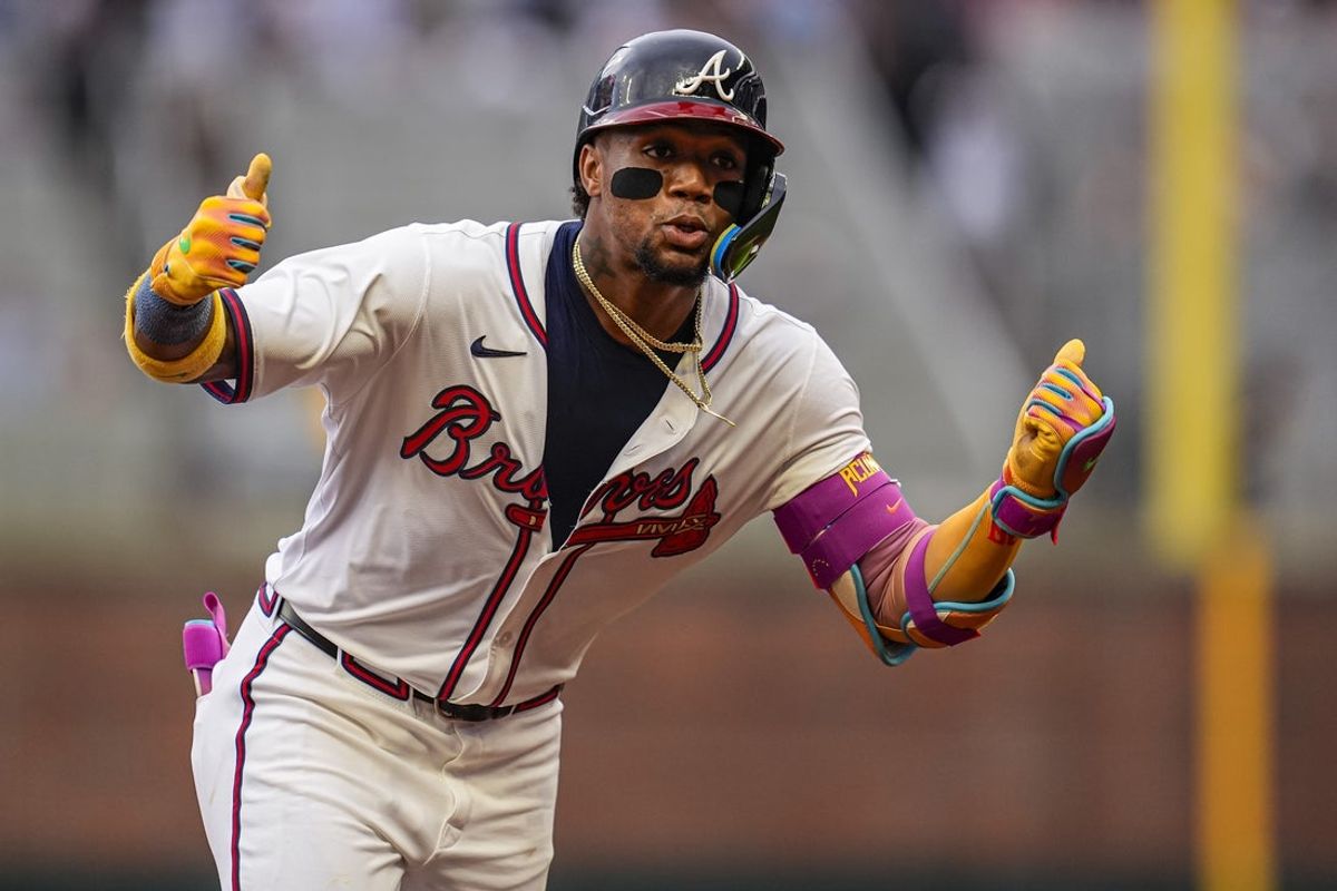 Jun 18, 2025; Cumberland, Georgia, USA; Atlanta Braves right fielder Ronald Acuna Jr (13) reacts after hitting a lead off home run against the New York Mets during the first inning at Truist Park. Mandatory Credit: Dale Zanine-Imagn Images