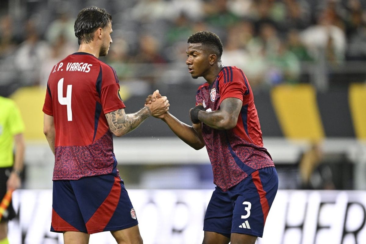 Jun 18, 2025; Arlington, Texas, USA; Costa Rica defender Jeyland Mitchell (3) and defender Juan Pablo Vargas (4) celebrate post game against the Dominican Republic during a group stage match of the 2025 Gold Cup at AT&T Stadium. Mandatory Credit: Jerome Miron-Imagn Images