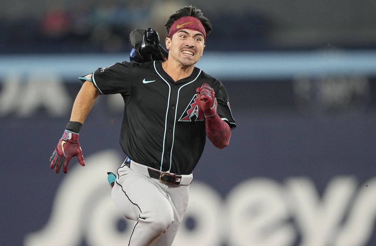 Jun 18, 2025; Toronto, Ontario, CAN; Arizona Diamondbacks right fielder Corbin Carroll (7) loses his helmet as he runs to third base on a triple against the Toronto Blue Jays during the sixth inning at Rogers Centre. Mandatory Credit: John E. Sokolowski-Imagn Images
