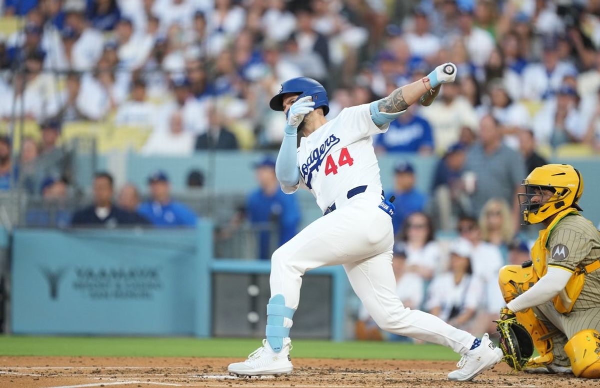 Jun 18, 2025; Los Angeles, California, USA; Los Angeles Dodgers center fielder Andy Pages (44) hits a double during the second inning against the San Diego Padres  at Dodger Stadium. Mandatory Credit: Kirby Lee-Imagn Images