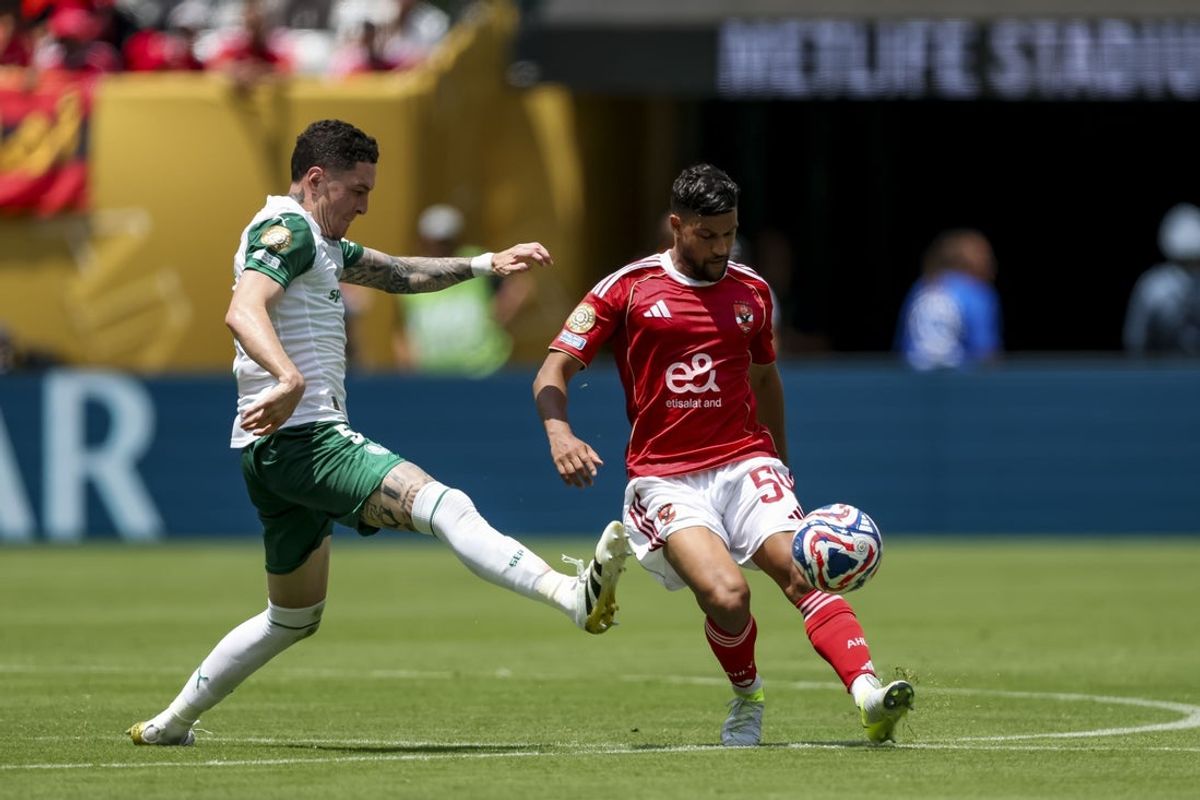 Jun 19, 2025; East Rutherford, New Jersey, USA; Al Ahly FC defender Yahya Attiyat Allah (54) and SE Palmeiras midfielder Anibal Moreno (5) battle for the ball during the second half during a group stage match of the 2025 FIFA Club World Cup at MetLife Stadium. Mandatory Credit: Vincent Carchietta-Imagn Images