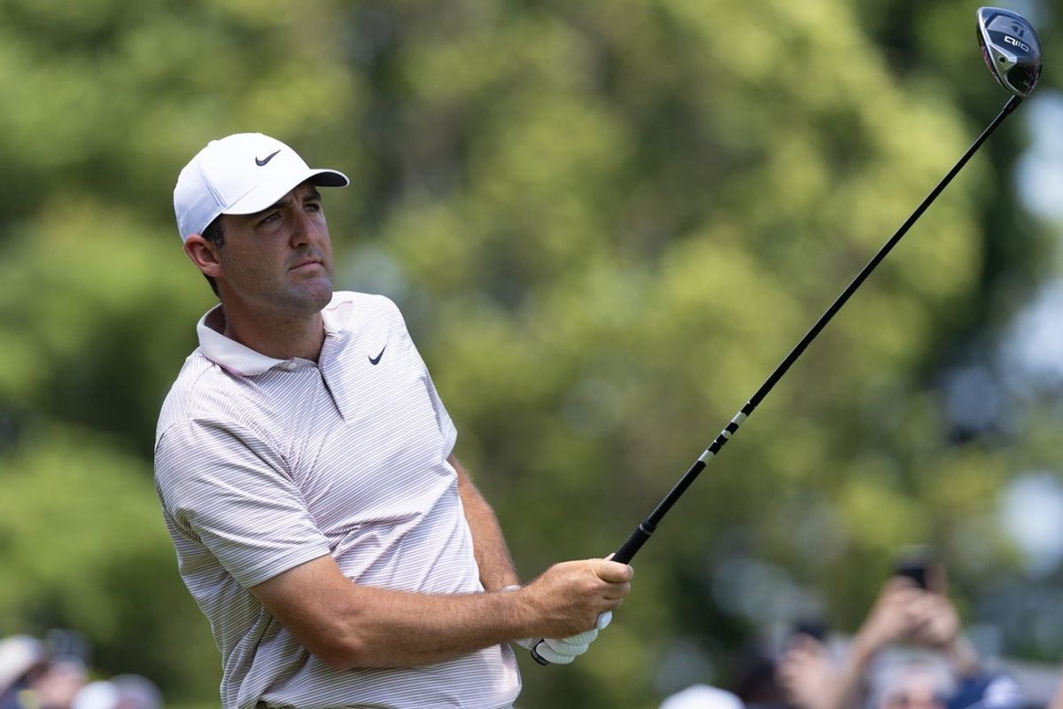Jun 19, 2025; Cromwell, Connecticut, USA; Scottie Scheffler plays his shot from the first tee during the first round of the Travelers Championship golf tournament. Mandatory Credit: Bill Streicher-Imagn Images