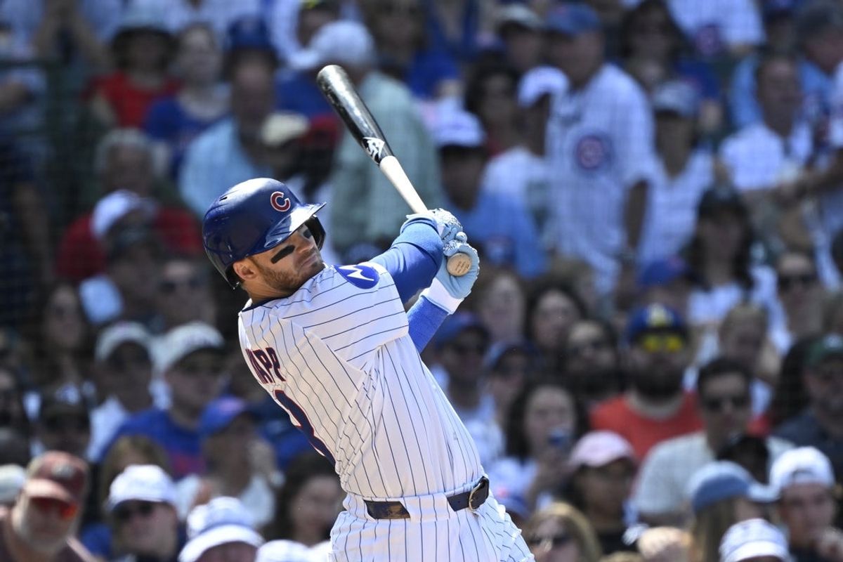 Jun 19, 2025; Chicago, Illinois, USA;  Chicago Cubs outfielder Ian Happ (8) hits a two run home run against the Milwaukee Brewers during the seventh inning at Wrigley Field. Mandatory Credit: Matt Marton-Imagn Images