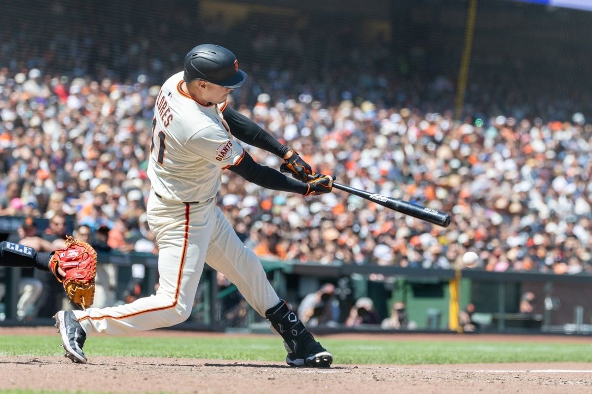 Jun 19, 2025; San Francisco, California, USA; San Francisco Giants first base Wilmer Flores (41) hits a double to score 2 runs during the seventh inning against the Cleveland Guardians at Oracle Park. Mandatory Credit: Bob Kupbens-Imagn Images