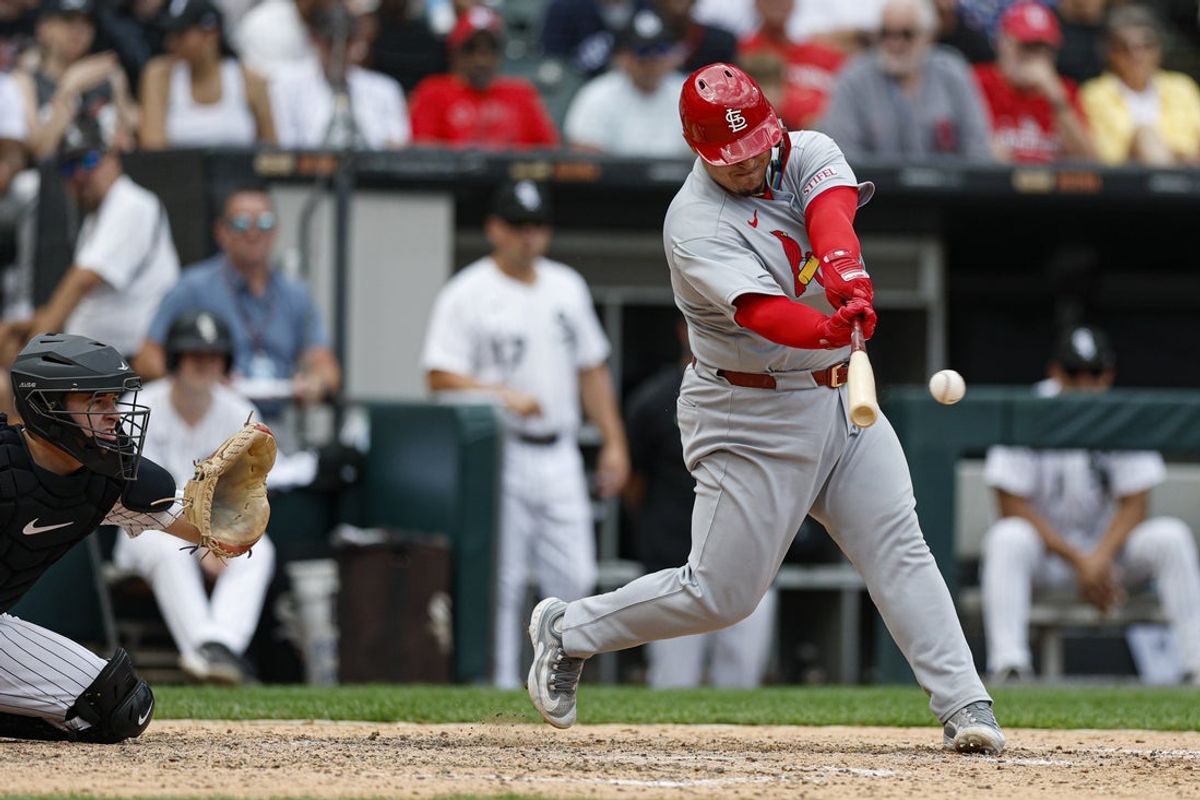 Jun 19, 2025; Chicago, Illinois, USA; St. Louis Cardinals catcher Yohel Pozo (63) hits an RBI-single against the Chicago White Sox during the eight inning of game one of the doubleheader at Rate Field. Mandatory Credit: Kamil Krzaczynski-Imagn Images