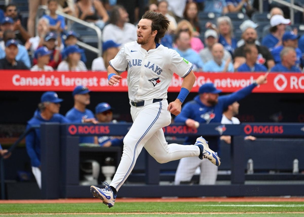 Jun 19, 2025; Toronto, Ontario, CAN;  Toronto Blue Jays right fielder Addison Barger (47) runs to home plate to score a run against the Arizona Diamondbacks in the eighth inning at Rogers Centre. Mandatory Credit: Dan Hamilton-Imagn Images