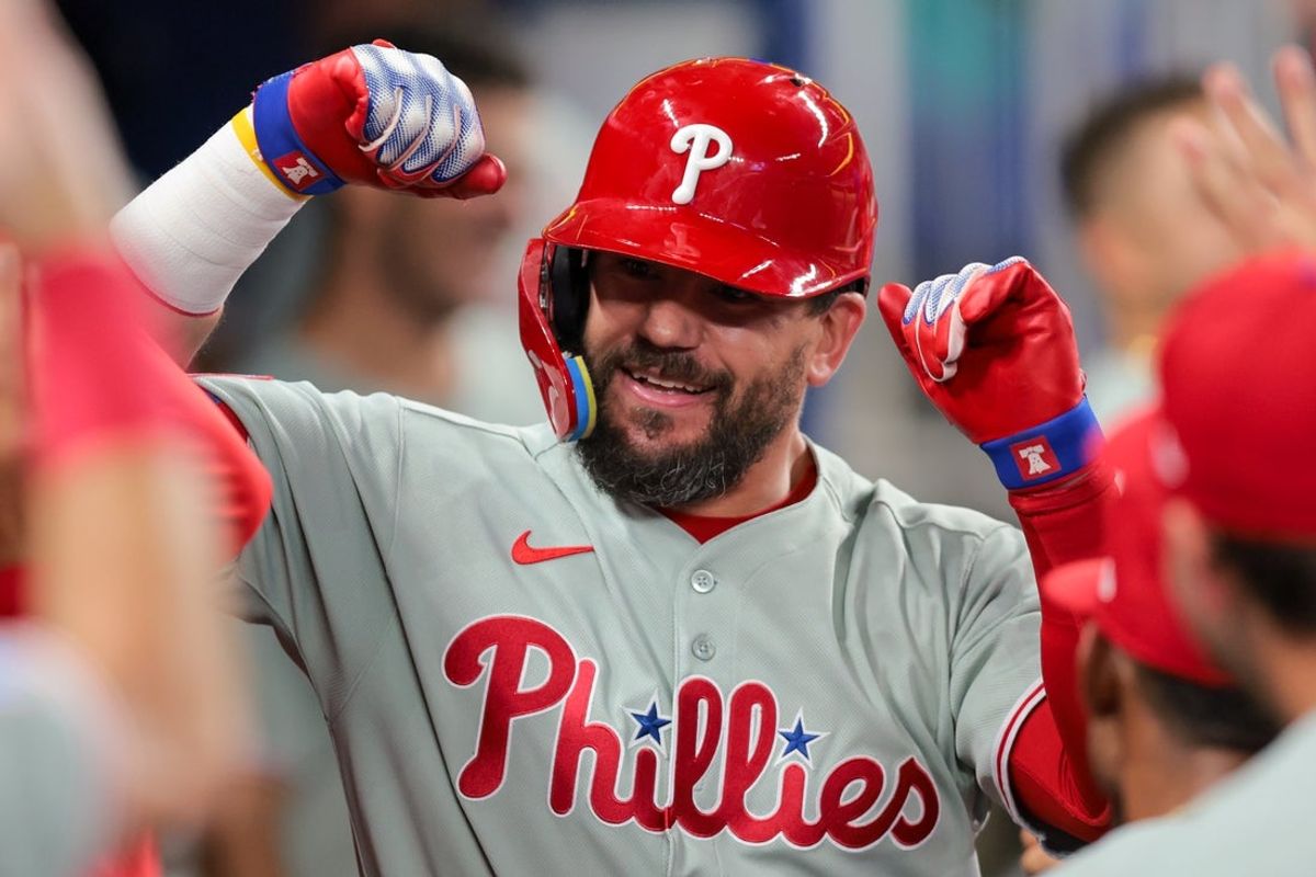 Jun 19, 2025; Miami, Florida, USA; Philadelphia Phillies designated hitter a (12) celebrates with teammates after hitting a solo home run against the Miami Marlins during the eighth inning at loanDepot Park. Mandatory Credit: Sam Navarro-Imagn Images