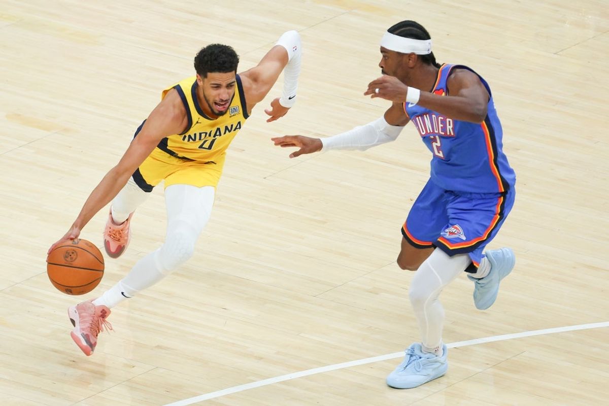 Jun 19, 2025; Indianapolis, Indiana, USA; Indiana Pacers guard Tyrese Haliburton (0) drives to the basket against Oklahoma City Thunder guard Shai Gilgeous-Alexander (2) in the first quarter during game six of the 2025 NBA Finals at Gainbridge Fieldhouse. Mandatory Credit: Trevor Ruszkowski-Imagn Images