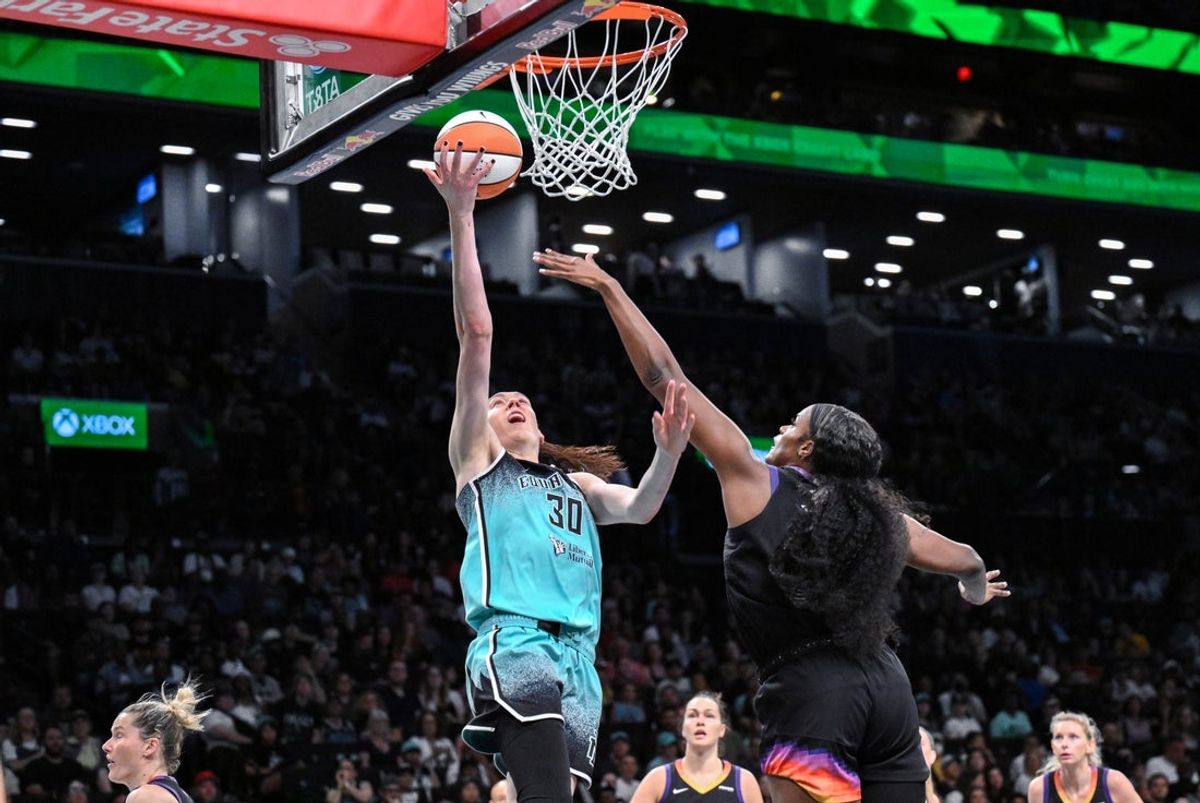 Jun 19, 2025; Brooklyn, New York, USA; New York Liberty forward Breanna Stewart (30) shoots the ball while being defended by Phoenix Mercury center Kalani Brown (21) during the first half at Barclays Center. Mandatory Credit: John Jones-Imagn Images