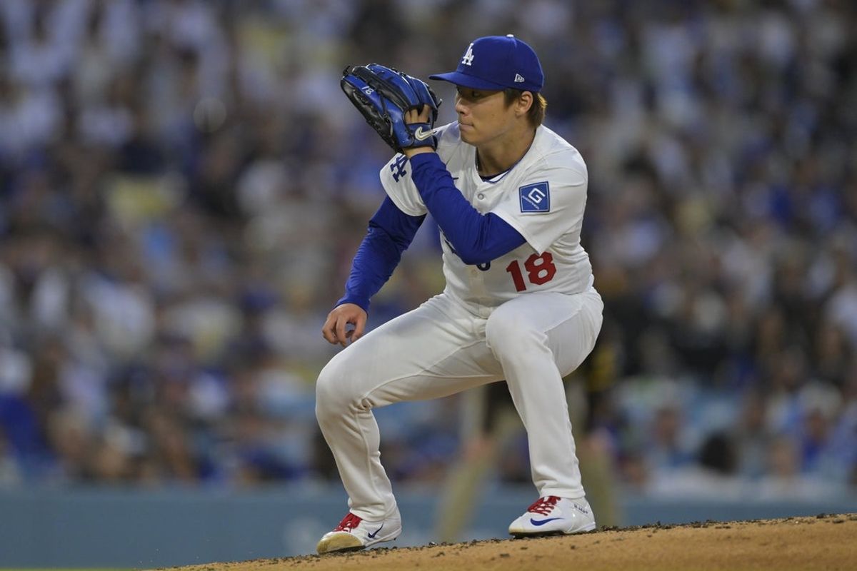 Jun 19, 2025; Los Angeles, California, USA;  Los Angeles Dodgers pitcher Yoshinobu Yamamoto (18) reacts during the fourth inning against the San Diego Padres at Dodger Stadium. Mandatory Credit: Jayne Kamin-Oncea-Imagn Images
