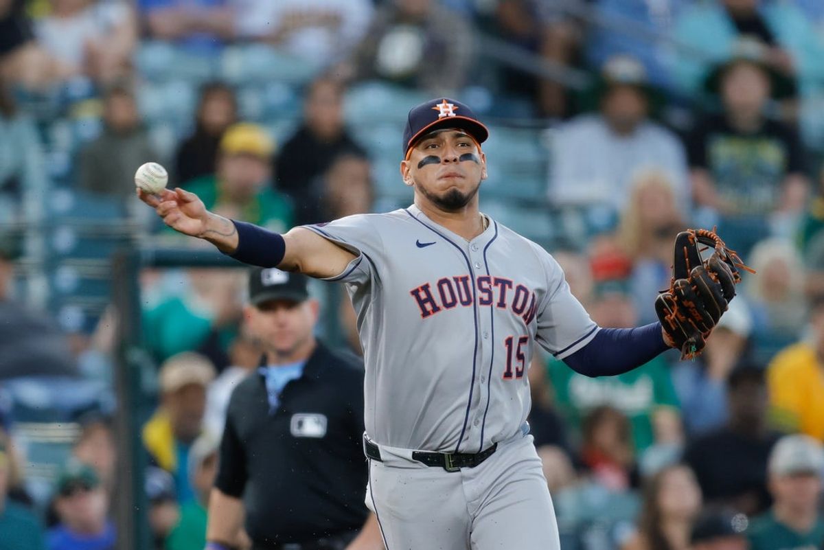 Jun 19, 2025; West Sacramento, California, USA; Houston Astros third baseman Isaac Paredes (15) throws the ball to first base for an out during the fourth inning against the Athletics at Sutter Health Park. Mandatory Credit: Sergio Estrada-Imagn Images