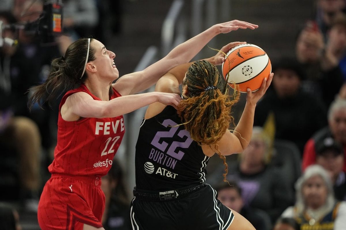 Jun 19, 2025; San Francisco, California, USA; Indiana Fever guard Caitlin Clark (left) fouls Golden State Valkyries guard Veronica Burton (right) during the fourth quarter at Chase Center. Mandatory Credit: Darren Yamashita-Imagn Images