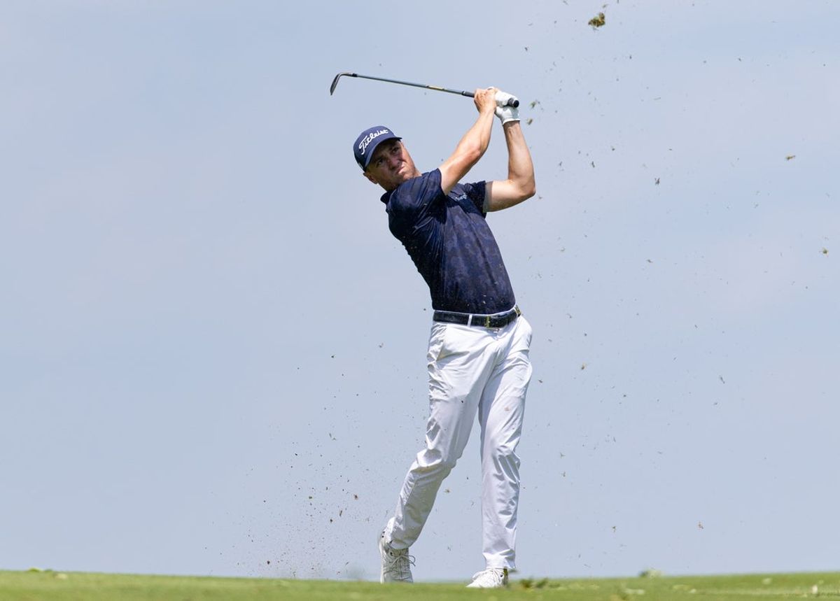 Jun 20, 2025; Cromwell, Connecticut, USA; Justin Thomas plays a shot on the 14th hole during the second round of the Travelers Championship golf tournament. Mandatory Credit: Bill Streicher-Imagn Images