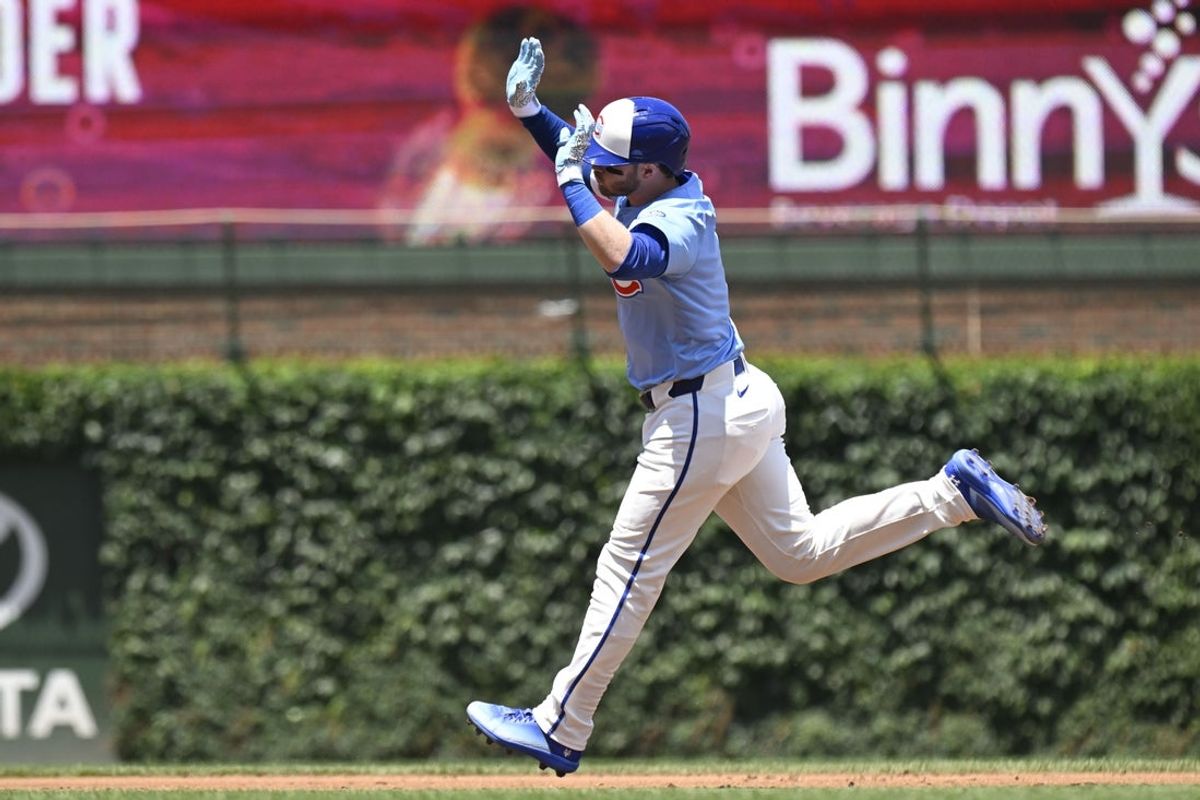 Jun 20, 2025; Chicago, Illinois, USA;  Chicago Cubs outfielder Ian Happ (8) pumps his fist after hitting a home run against the Seattle Mariners during the first inning at Wrigley Field. Mandatory Credit: Matt Marton-Imagn Images