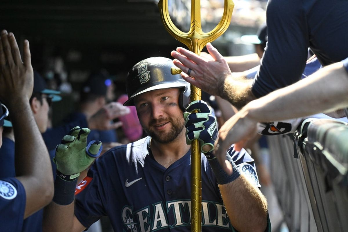 Jun 20, 2025; Chicago, Illinois, USA;  Seattle Mariners catcher Cal Raleigh (29) celebrates in the dugout after hitting a two run home run against the Chicago Cubs during the seventh inning at Wrigley Field. Mandatory Credit: Matt Marton-Imagn Images