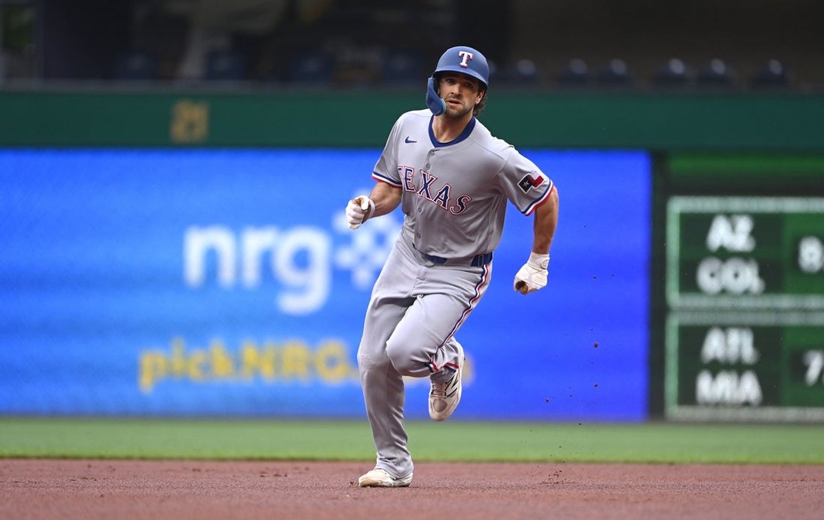 Jun 11, 2025; Pittsburgh, Pennsylvania, USA; Texas Rangers runner Josh Smith rounds second and heads to third on a single against the Pittsburgh Pirates during the first inning at PNC Park. Mandatory Credit: Philip G. Pavely-Imagn Images