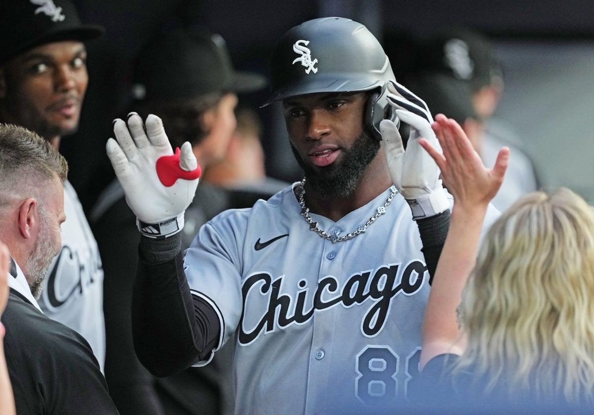 Jun 20, 2025; Toronto, Ontario, CAN; Chicago White Sox centre fielder Luis Robert Jr. (88) celebrates in the dugout after hitting a two run home run against the Toronto Blue Jays during the third inning at Rogers Centre. Mandatory Credit: Nick Turchiaro-Imagn Images